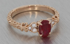 14ct Rose gold oval ruby and diamond ring