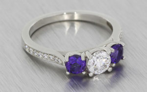 Platinum trilogy ring with amethysts and diamonds