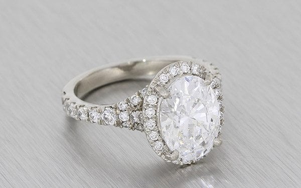 A Striking Oval Diamond Housed In A Stunning Diamond Halo