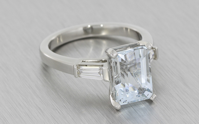 Aquamarine and tapered baguette moissanite trilogy ring set in platinum