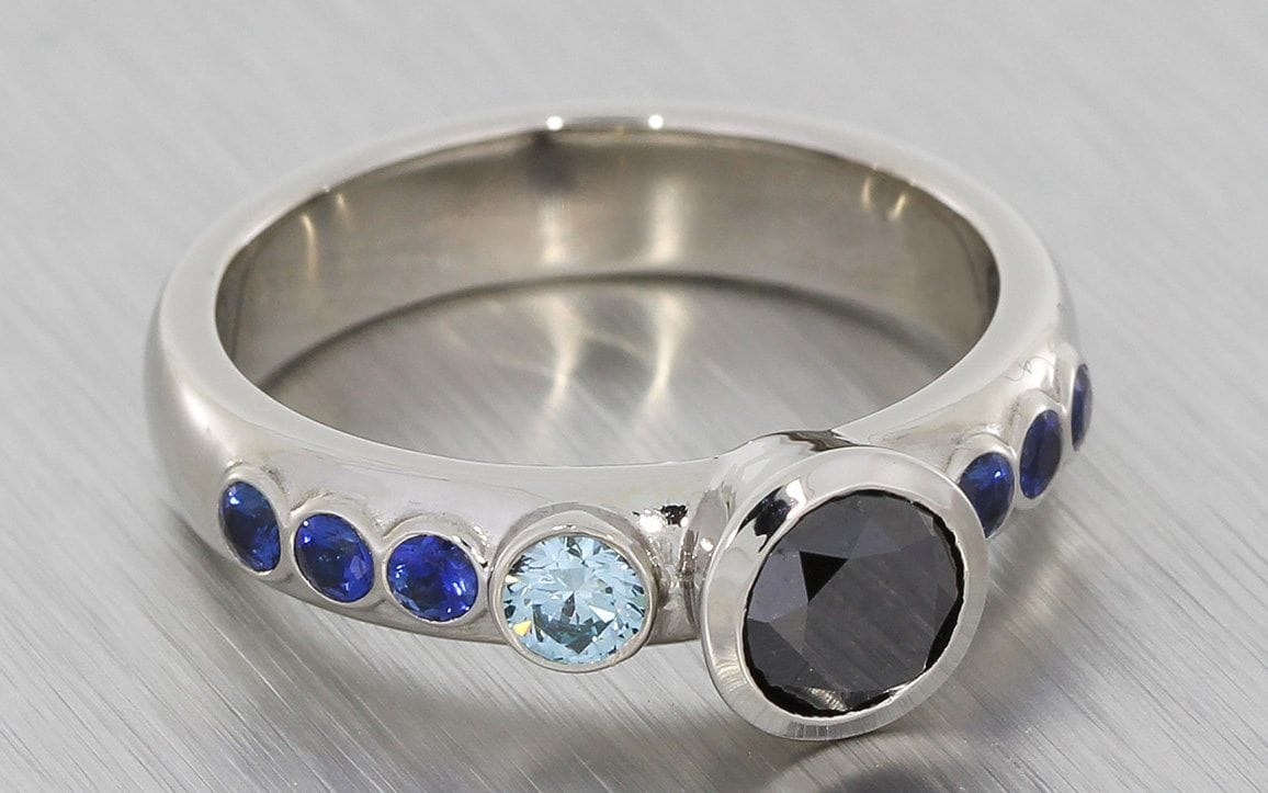 Asymmetrical-black-and-blue-diamond-engagement-ring-Feature-1
