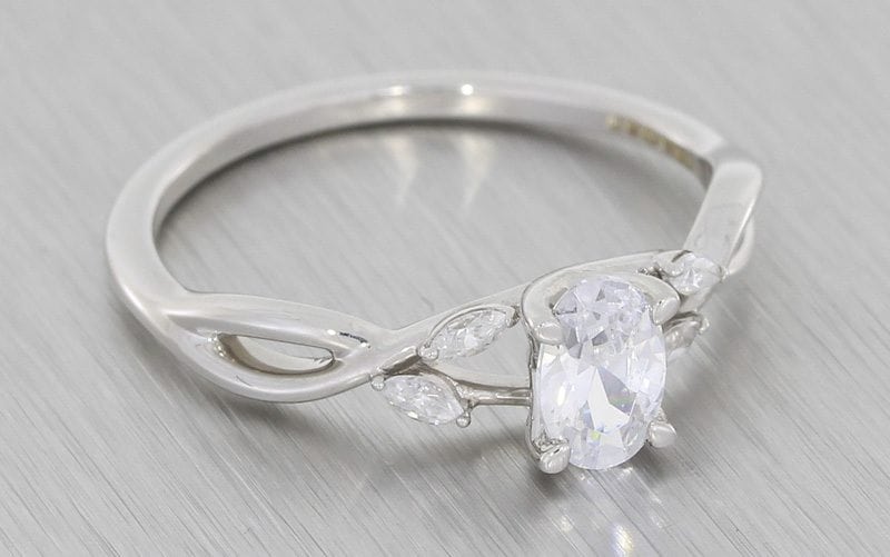 Organic Oval diamond crossover engagement ring – Portfolio