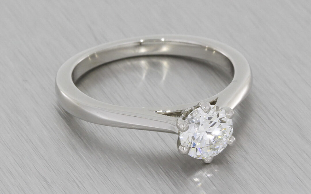 Platinum Round brilliant diamond ring with a matching diamond wedding band