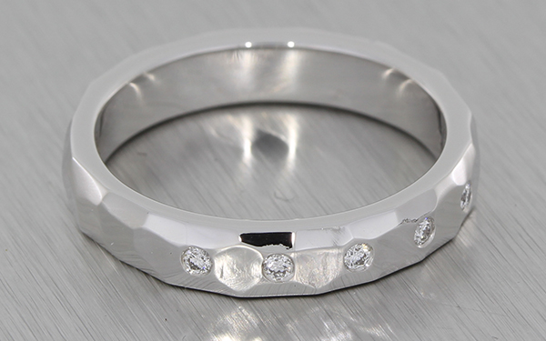 18ct white gold band set with invisible set round brilliant diamonds