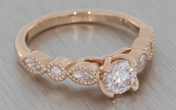 Rose gold with fancy shape diamond and moissanite ring